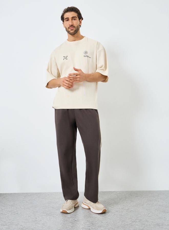 Styli Men Brown Striped Relaxed Joggers - Image 1